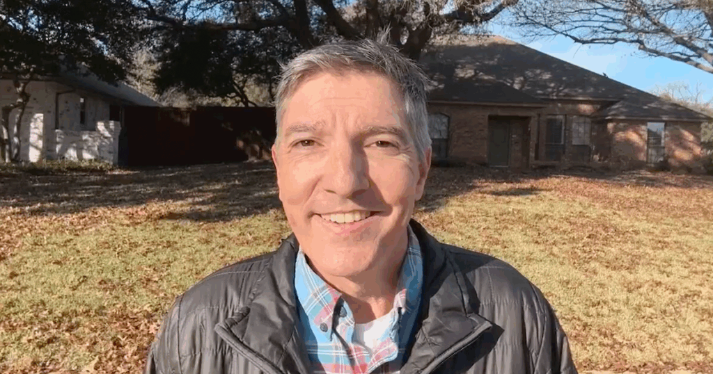 Photo of Village Green founder and president Ken Hyatt in a dormant winter lawn in Plano, Texas.